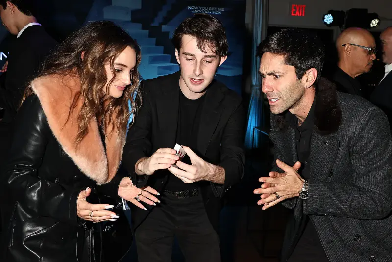 Jacob performing a card trick for guests at the Now You See Me premiere